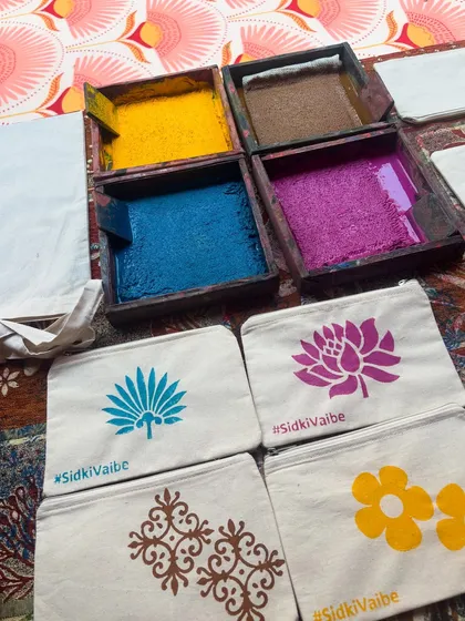 For the Haldi party of the Birla and Gokuldas family, we created a special custom block with their wedding hashtag, #SidkiVaibe. Guests loved printing the hashtag on their pouches, creating a personalized keepsake to remember the beautiful celebration. It's these little details that make an event truly memorable.