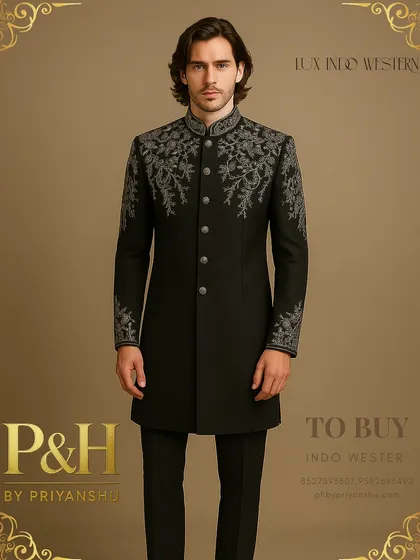 This black Indo-Western suit features a different style of floral hand-embroidery, offering a sophisticated and artistic take on groomswear. The craftsmanship is evident in every stitch.