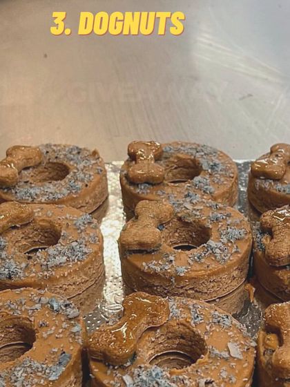 My dognuts are a party favorite. These are topped with a peanut butter-based frosting, coconut sprinkles, and a small biscuit for an extra crunch.