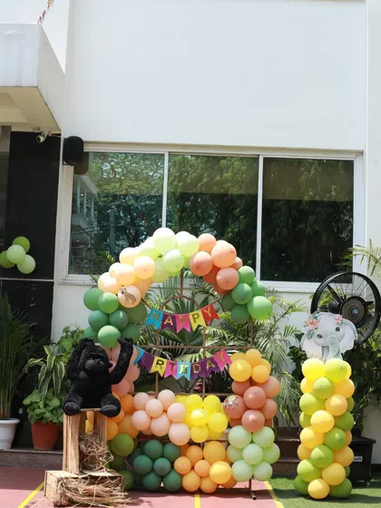 Another look at the jungle-themed photo backdrop, perfect for capturing memories of the special day.