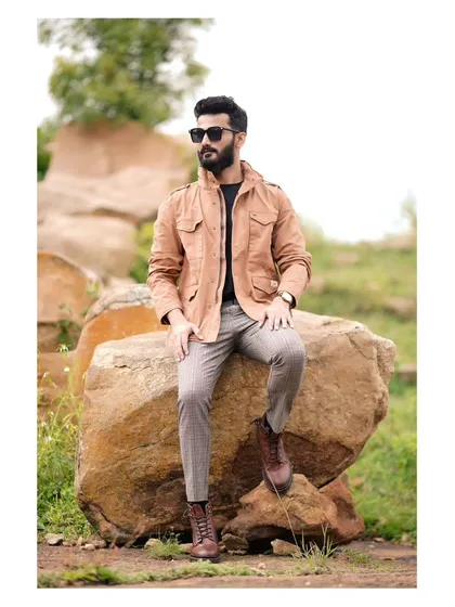 For men's fashion, I focus on capturing a sense of confident, effortless style. This outdoor portfolio shoot combines a rugged natural landscape with a dapper, layered look, creating a compelling commercial image for fashion brands.
