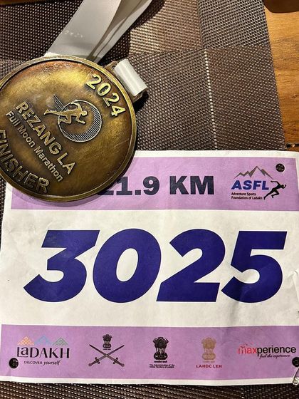 The finisher's medal from the Rezang La Full Moon Marathon. This represents not just a race completed, but a journey of dedication, perseverance, and the successful application of our sports physiotherapy principles.
