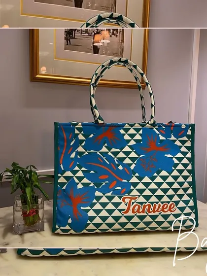 A unique geometric print tote bag in shades of blue and green, personalised for 'Tanvee'. A stylish way to carry your belongings.