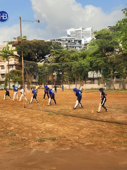 A wide shot of our cricket practice session, showing multiple players engaged in batting drills. This illustrates the dynamic and active environment of our coaching programs.
