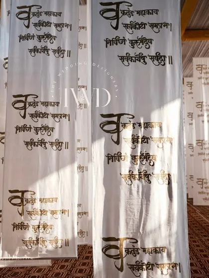 For a spiritual gathering, we created an immersive space with hanging fabric scrolls printed with sacred Sanskrit chants. The light filtering through them created a serene and divine ambiance.