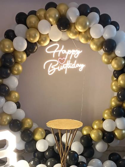 A close-up of the "Happy Birthday" neon sign with a heart, a popular add-on for any setup.