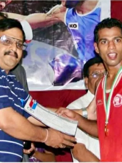 Receiving an award during my competitive years. These moments of victory fuel my passion for coaching.