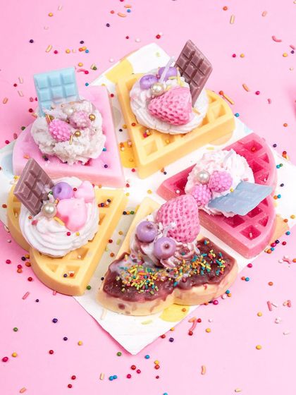 A fun arrangement of my waffle candles, each with unique toppings. I love playing with colors and small embeds to make every piece different. They are a whimsical and delicious-looking addition to any decor.