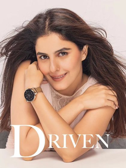 A shot of Isha Talwar for the "Driven" theme of the Noise campaign. The simple, elegant styling ensures the focus remains on her expression and the smartwatch, conveying ambition and focus.