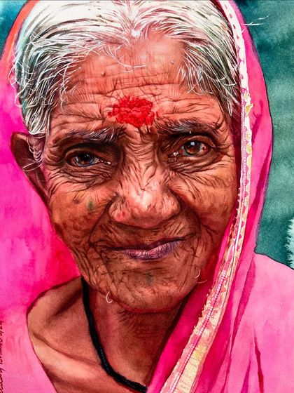 This portrait from a complete watercolor course focuses on capturing a warm, friendly expression. The bright pink of her sari and the large bindi are central elements of the composition.