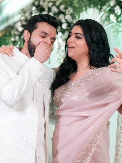 A candid moment of surprise and laughter during the reception. It's these unscripted reactions that bring so much life to a wedding film.