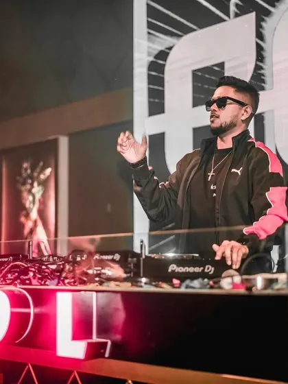 A stylish shot of me at the decks at Club EDL in Jodhpur, showing my cool and confident stage presence.