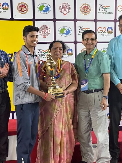 K J Akash receiving his double gold medal trophy at the All India School Games, a significant achievement in school-level national sports.