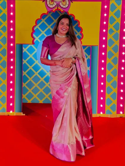 The full view of my elegant saree against the colorful festive background.