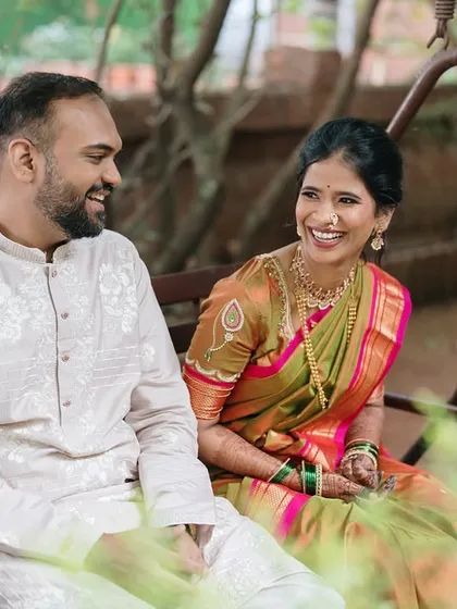 Sharing a moment on a garden swing. This shot captures the simple joys and easy laughter that are the foundation of a strong partnership.