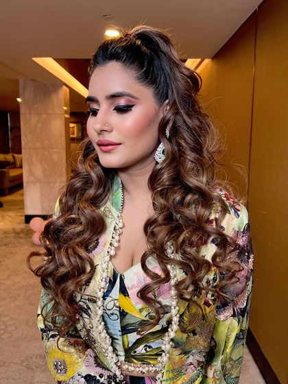 A close-up of the makeup, with soft eye makeup and beautiful bouncy curls.