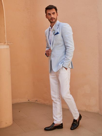 The full look of the Arctic Blue linen suit, showcasing its clean lines and modern silhouette. It's crafted from premium Irish linen, making it the ideal choice for staying stylish in the Indian summer.