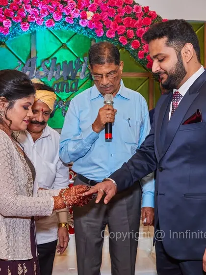 Capturing the formal ring exchange ceremony, with family and the priest present. I document these traditional rituals that are a core part of the engagement celebration.