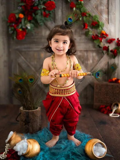 This little Krishna is standing tall and proud with his flute.