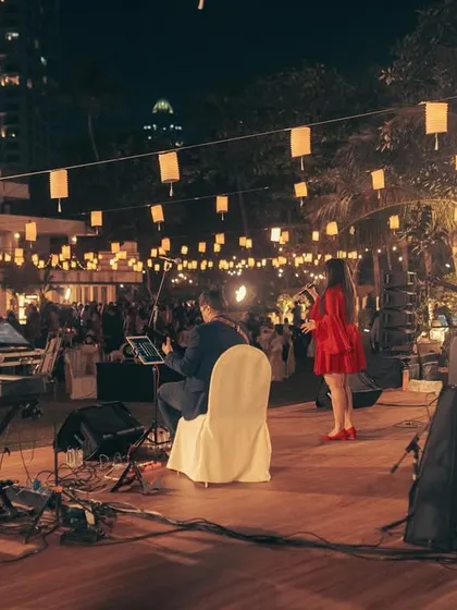 A wide shot of our stage setup for an outdoor wedding. The beautiful lighting and ambiance complemented our music perfectly.