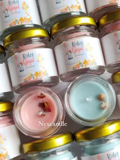 An overhead view of the assorted baby shower candles. I offer different colors and can add toppings like dried flowers or shells to match your theme.