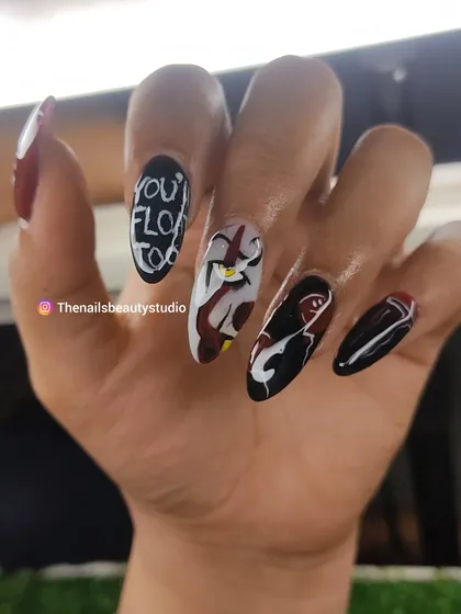 A spooky set inspired by the movie "IT," featuring a hand-painted portrait of Pennywise the clown.