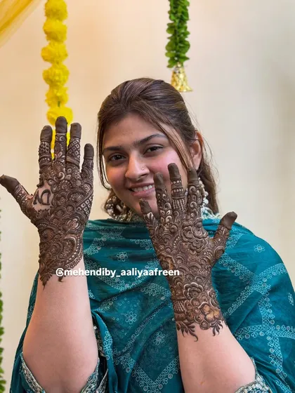 A gorgeous design for Nausheen didi, featuring her initial 'N' prominently on the palm.