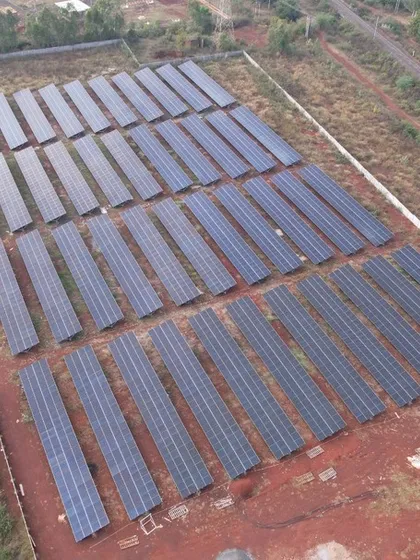 Another perspective of the 1.3 MW solar power plant, highlighting its integration into the rural landscape. Such projects are vital for creating a decentralized and resilient energy infrastructure for India.