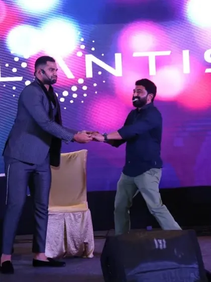 It's not just a performance; it's an interaction. Here I am on stage at the Ritz-Carlton for a Stellantis corporate event, pulling a guest into the act. This is what I mean by making everyone feel like part of the magic.