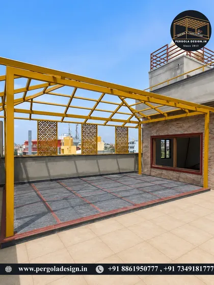 A wider view of the newly installed yellow pergola frame. The structure defines a large, open area on the terrace, ready for the roofing and finishing touches.