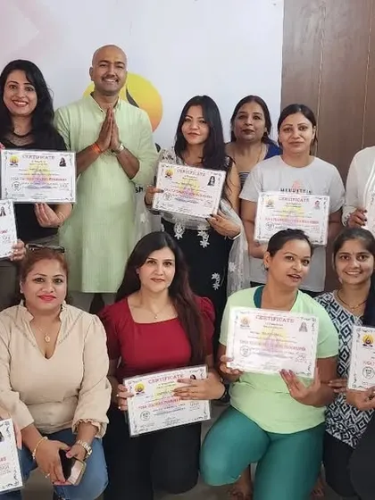 A group photo of our recent 200-hour YTT graduates with their certificates. We celebrate their dedication and wish them well on their teaching journey.