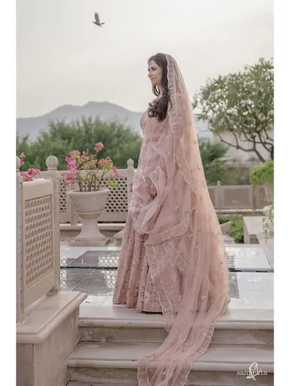 A portrait of the bride, Pearl, with a bird taking flight in the background. It’s a lucky, serendipitous moment that adds a touch of magic to this elegant bridal shot.