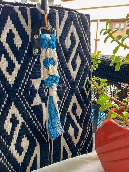 Bringing some beachy vibes with this ocean-themed keychain. I used blue and white cords and added real cowrie shells for a perfect bohemian, coastal feel.