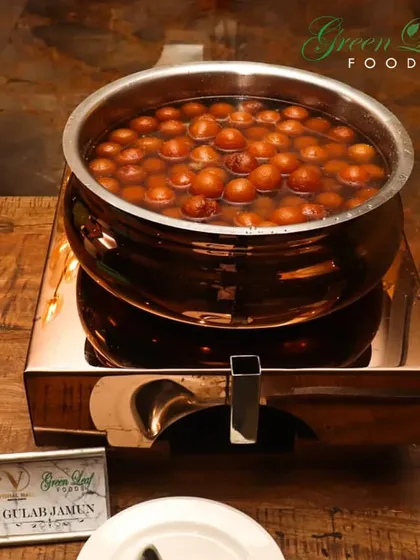 No Indian wedding is complete without hot Gulab Jamun. We serve these soft, syrup-soaked delights warm from a traditional copper pot, ensuring they are as comforting and delicious as they should be.
