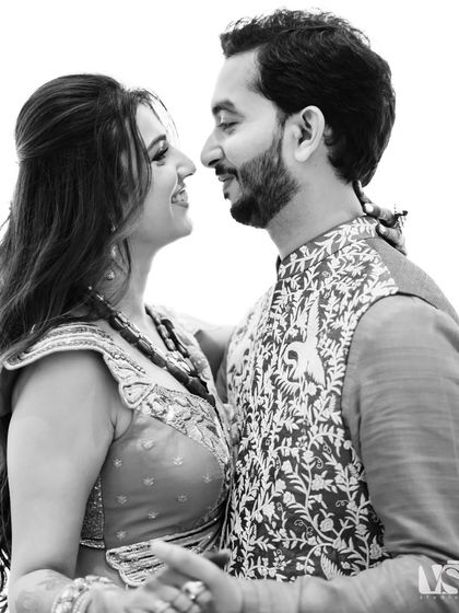 A classic black and white close-up of a couple about to kiss. This timeless portrait beautifully captures the intimacy and connection between them.