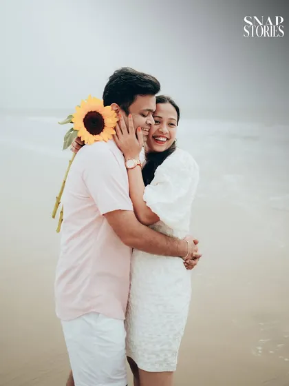 Pre-wedding shoots should be fun and reflect your personality. This candid shot captures a moment of pure joy and laughter during a relaxed, casual pre-wedding session on a Mumbai beach.