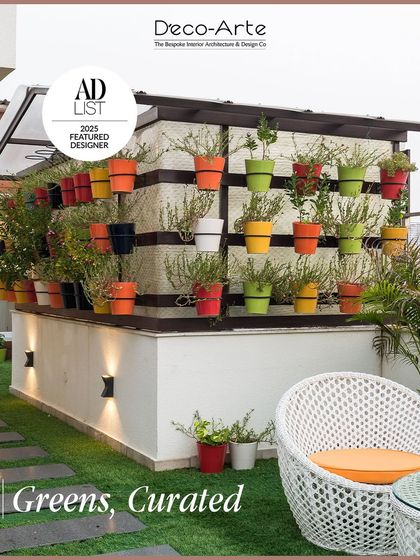 Where design meets nature in perfect balance. We don't just add greenery; we compose it. This curated vertical garden with subtle up-lighting creates tranquil moments in a modern outdoor setting.