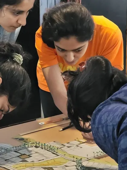 Our dedicated team working together on a concept design model. This collaborative, hands-on approach is crucial for refining the details of a master plan and ensuring every element works in harmony.