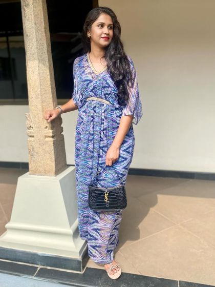 A closer view of Smitha's printed kaftan, showing the beautiful drape and vibrant pattern.