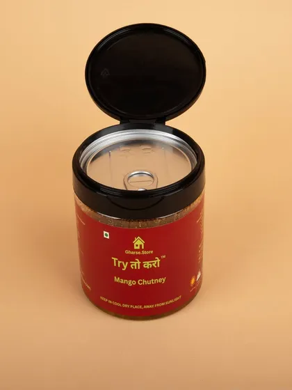 A jar of Mango Chutney with its lid open, showing the pull-tab seal to indicate freshness and secure packaging.