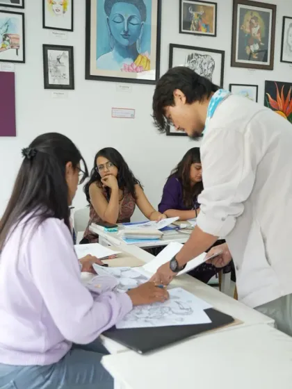 An instructor provides guidance to a student during a sketching class. Our short-term courses offer personalized attention to help you build a strong foundation.