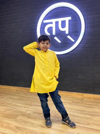 A confident pose from another one of my students in his festive attire. I love seeing them embrace different looks for their performances.