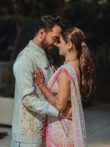 A romantic moment between the couple at the carnival event.