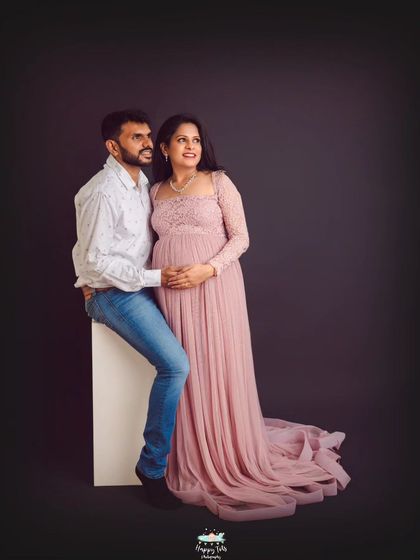 A candid moment of the couple looking towards their future together. We styled this shot with our elegant pink lace gown against a simple backdrop to keep the focus on their connection.
