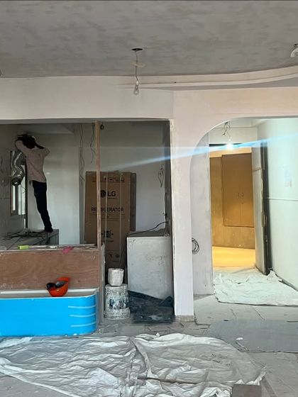 This "before" image shows the initial state of the living area. It was a blank canvas where we envisioned a space rooted in tradition, planning the layout and material palette that would transform it into a peaceful sanctuary.