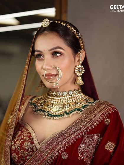 A beautiful example of a traditional red and gold bridal look. The student has expertly balanced a bold lip with defined eyes and glowing skin for a timeless finish.