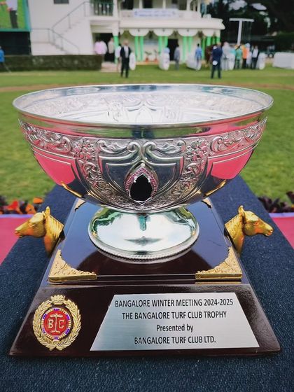 The Bangalore Turf Club Trophy, an ornate silver bowl with horse head handles.