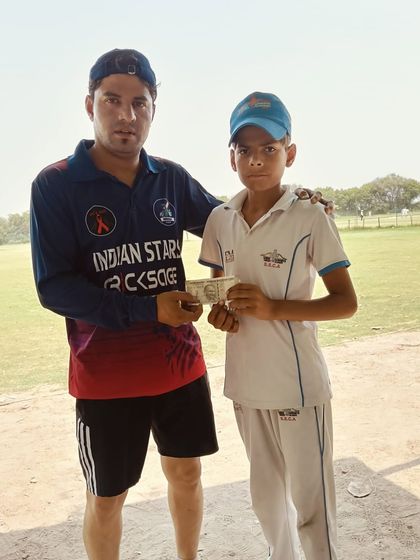 Rewarding Ayush Chaursia with a cash prize for his Man of the Match performance. A small token of appreciation for a great game.