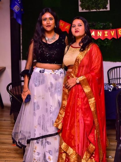 Friends posing for a photo at the Dandiya event.