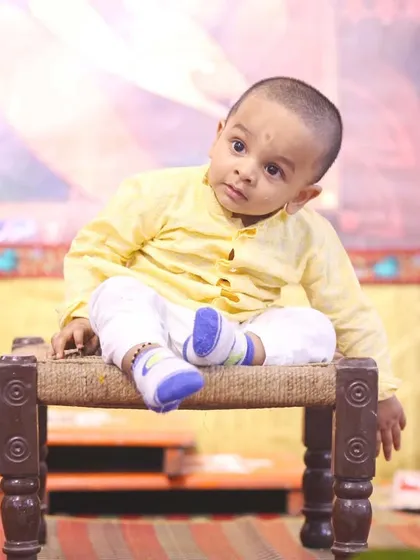 A candid shot of the birthday boy, looking curious and cute. I focus on capturing both posed and natural moments during events.